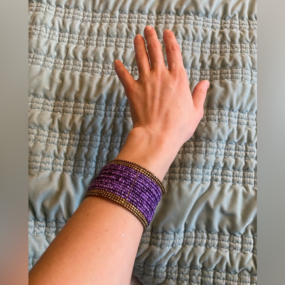 Dark purple, light purple and brass colored glass bead statement bangle bracelet